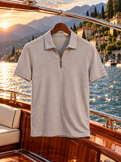 Dreamsia men's light gray quarter-zip performance polo hanging at Lake Como